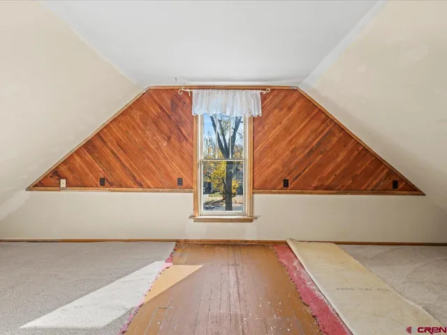 a view of an empty room and stairs