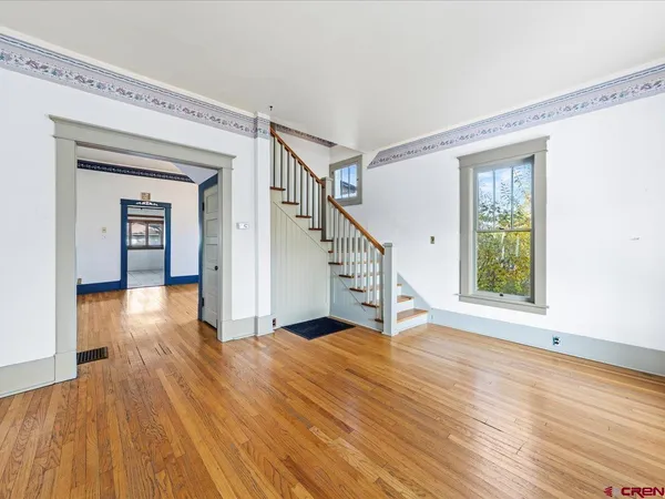 a view of entryway with wooden floor