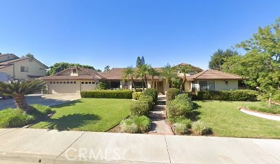 7035 Edgewild Drive Riverside, CA 92506 - Photo 1 of 1 a front view of a house with a yard and garage