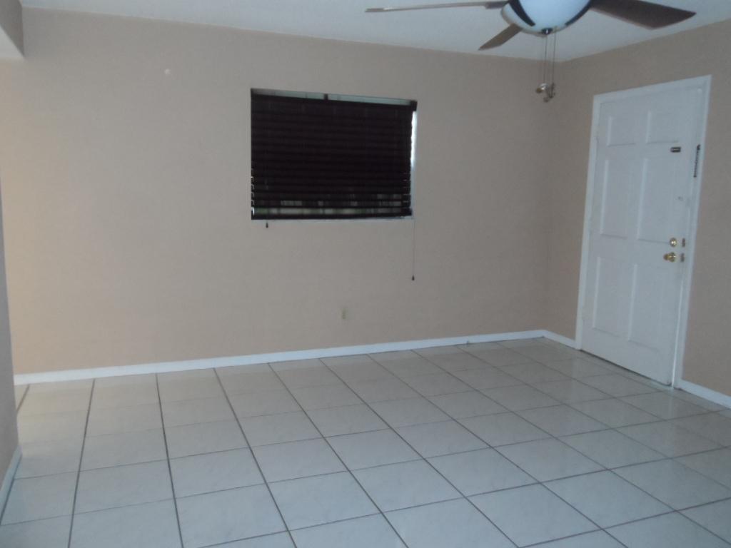 336 Southwest 1st Street, Unit B8 Pompano Beach, FL 33060 - Photo 4 of 11 a view of an empty room with a window