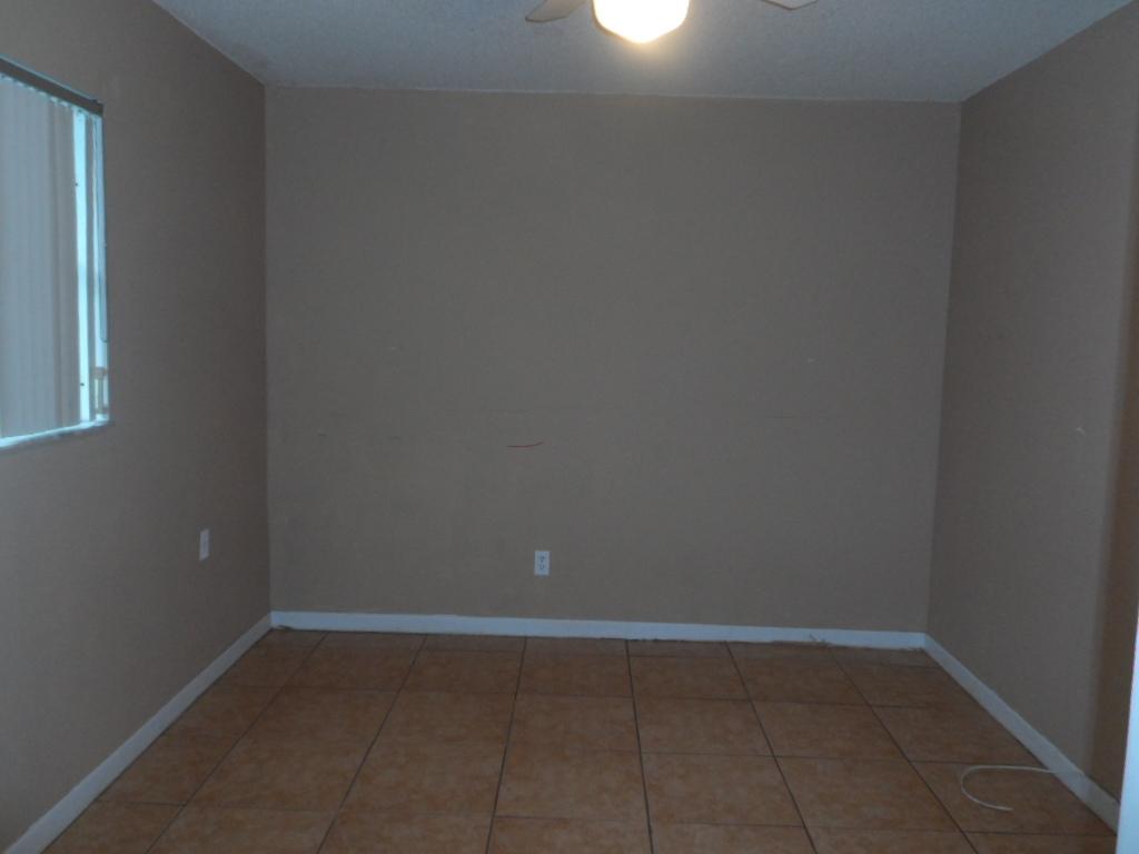 336 Southwest 1st Street, Unit B8 Pompano Beach, FL 33060 - Photo 5 of 11 a room that has a window in it