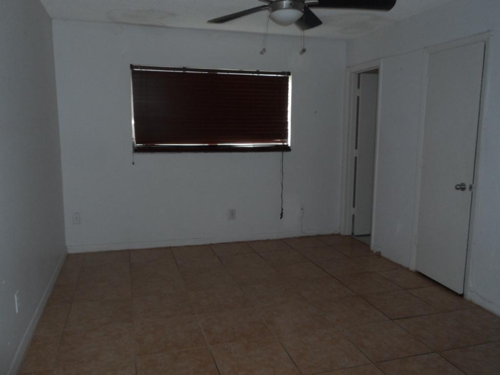 336 Southwest 1st Street, Unit B8 Pompano Beach, FL 33060 - Photo 6 of 11 a living room with a empty space