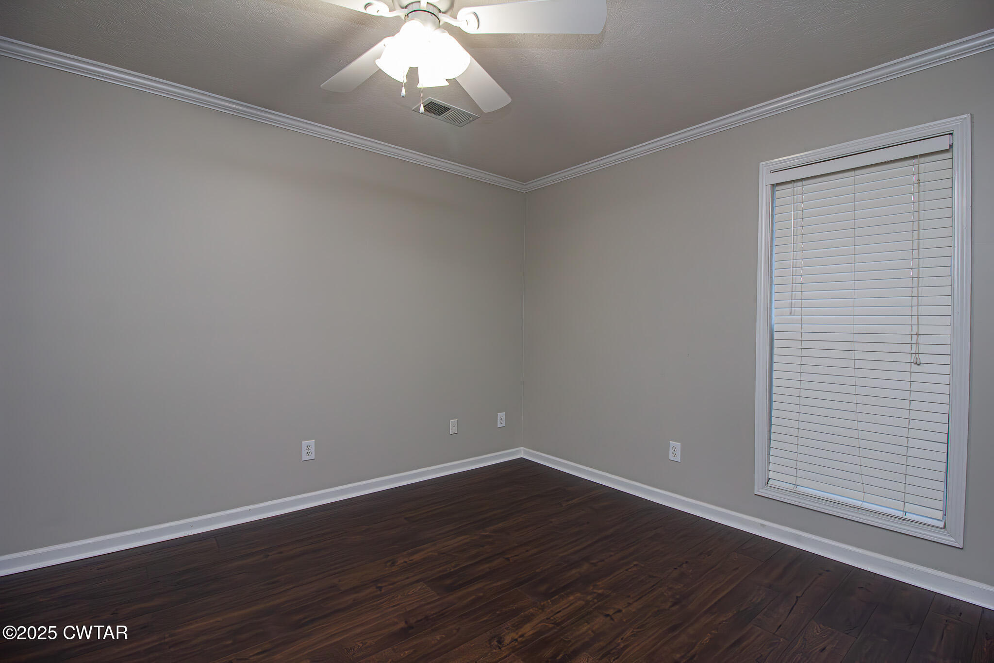 88 Rooker Drive Jackson, TN 38305 - Photo 14 of 20 a view of an empty room with wooden floor and a window