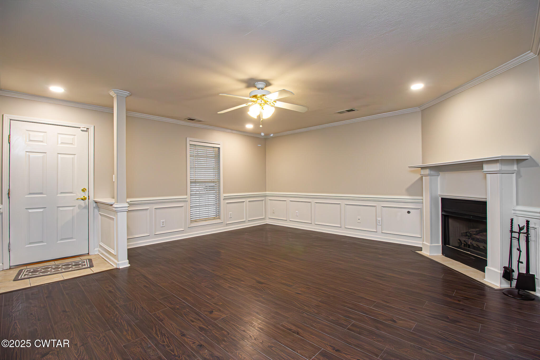 88 Rooker Drive Jackson, TN 38305 - Photo 3 of 20 a view of an empty room with wooden floor fireplace and a window