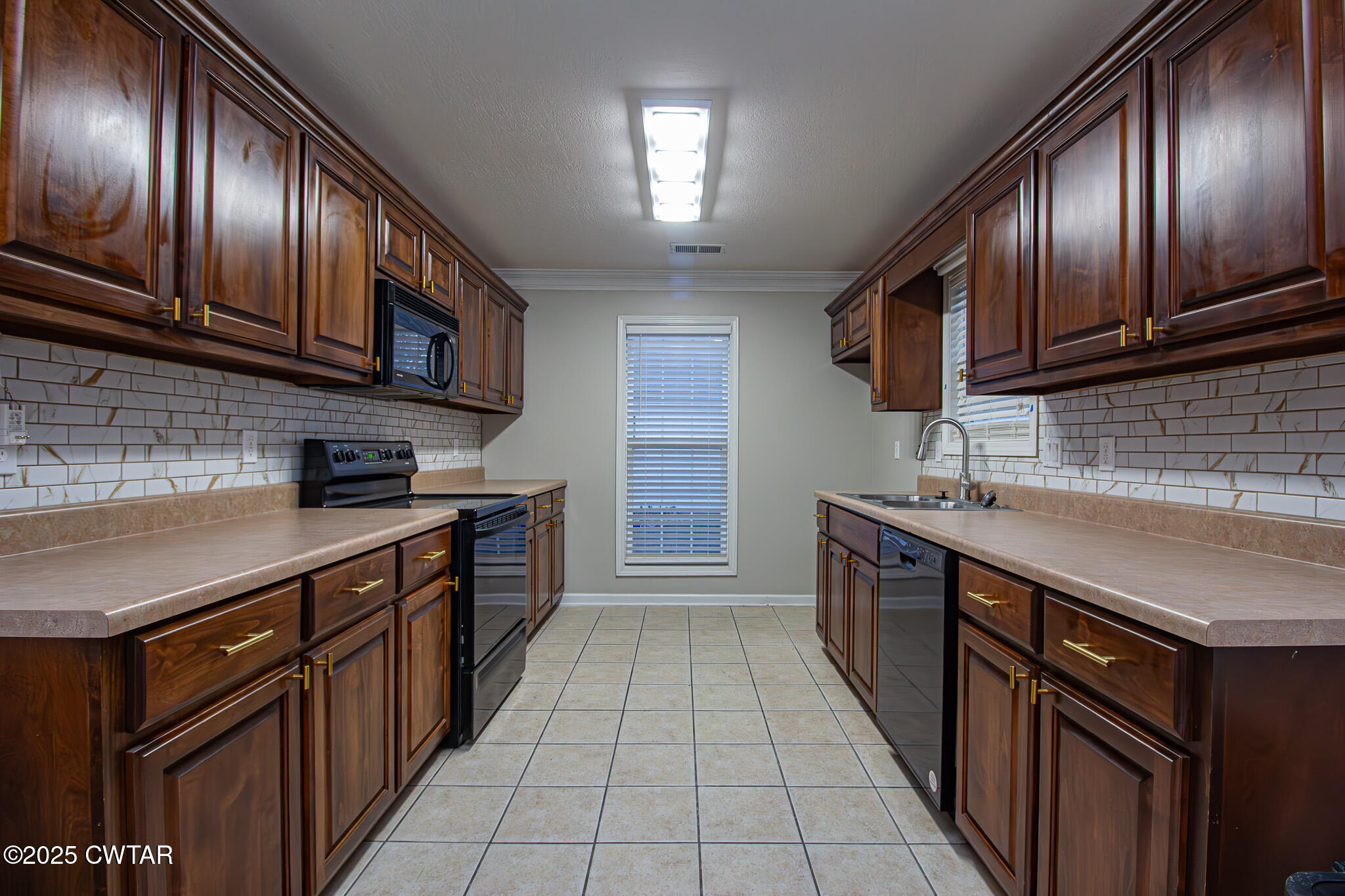 88 Rooker Drive Jackson, TN 38305 - Photo 5 of 20 a kitchen with stainless steel appliances granite countertop wooden cabinets a stove top oven a sink and dishwasher