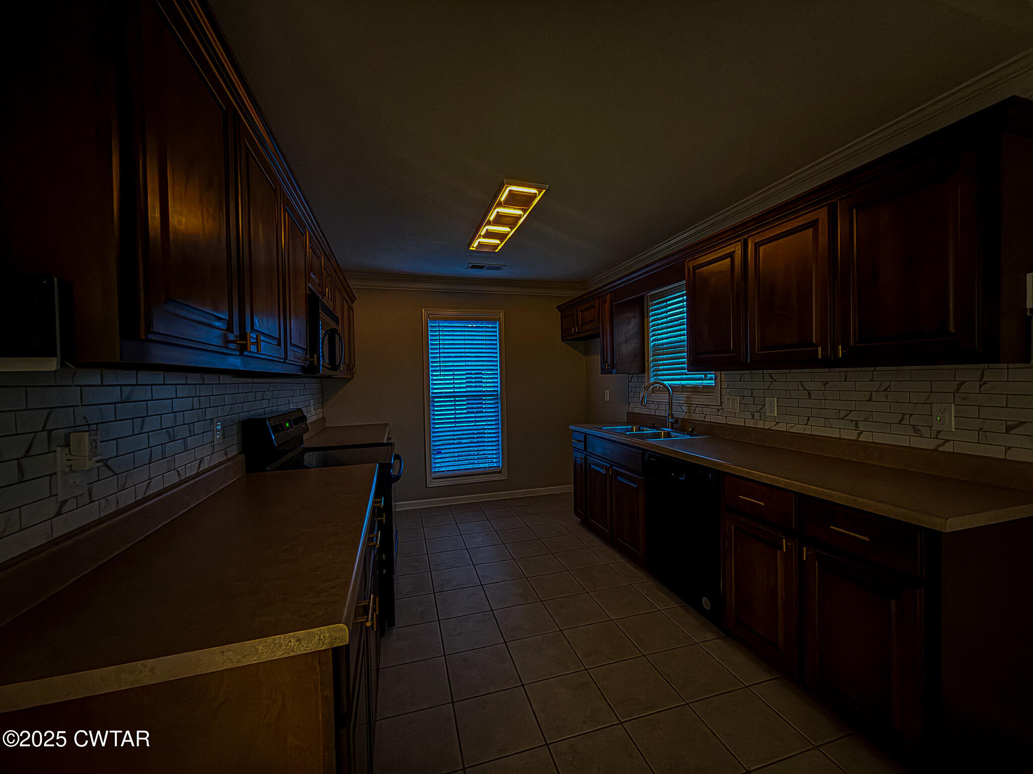 88 Rooker Drive Jackson, TN 38305 - Photo 6 of 20 a kitchen with granite countertop wooden cabinets and a stove top oven