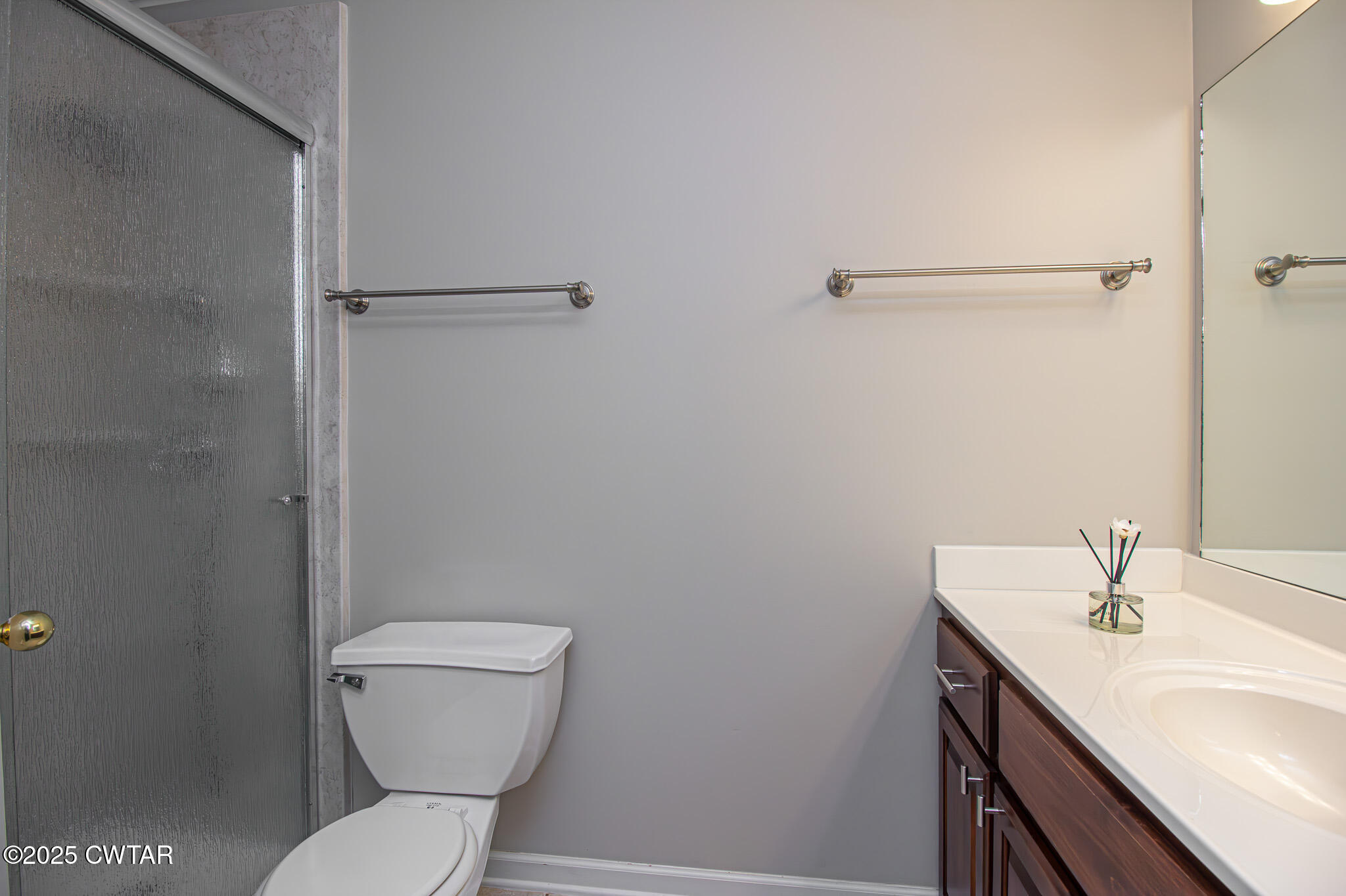 88 Rooker Drive Jackson, TN 38305 - Photo 10 of 20 a bathroom with a toilet sink and mirror