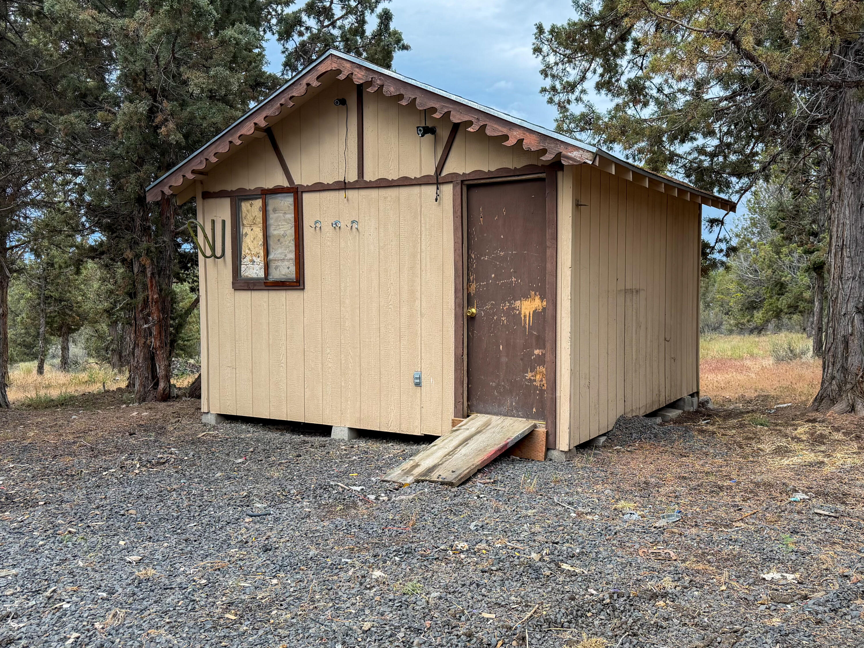 14375 Southeast Juniper Canyon Road Prineville, OR 97754 - Photo 2 of 10 a view of a house with a yard