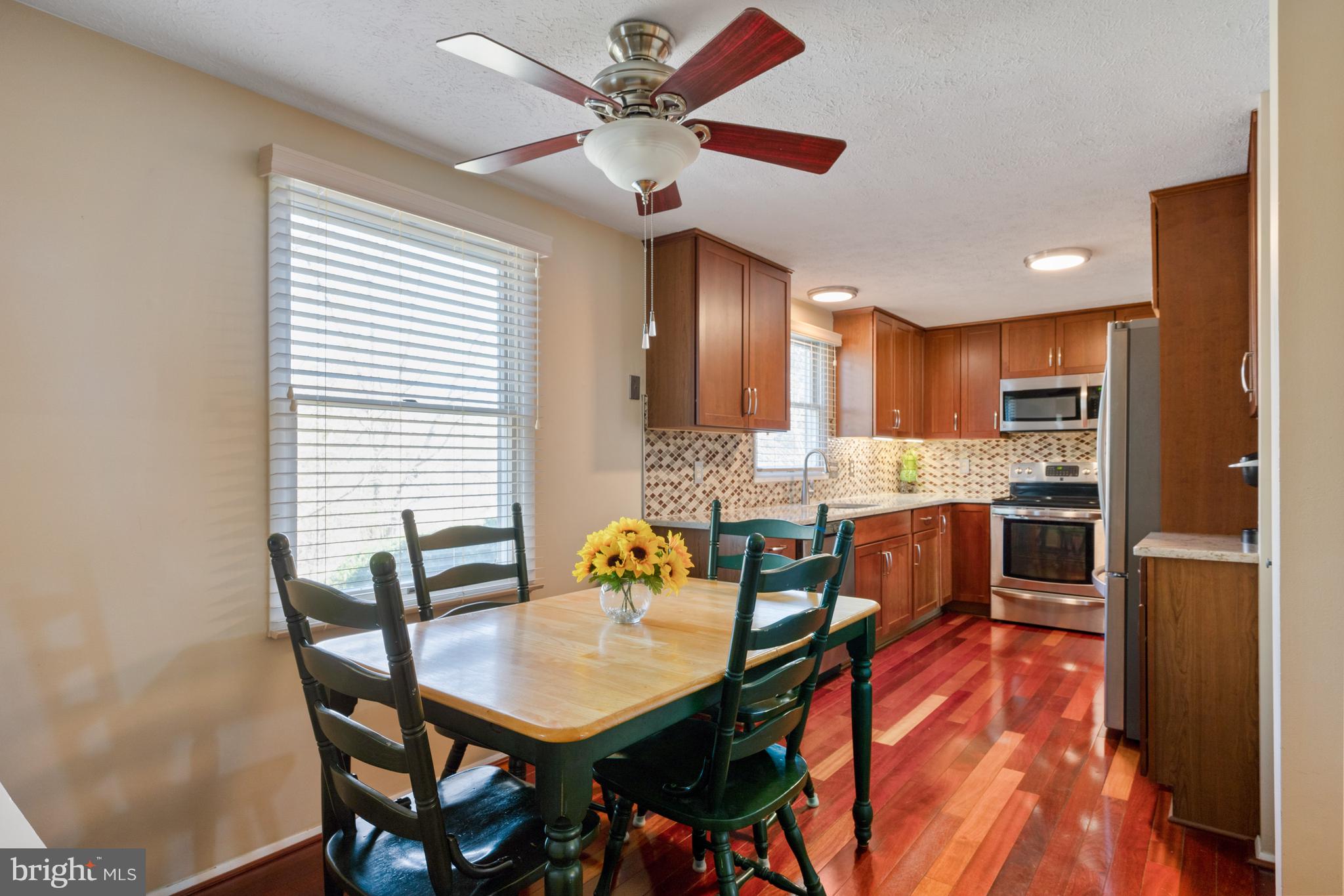 4401 Cub Run Road Chantilly, VA 20151 - Photo 17 of 60 a view of a dining room with furniture and a chandelier