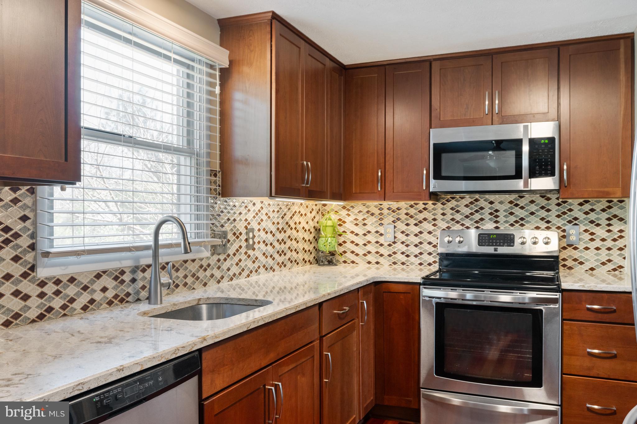4401 Cub Run Road Chantilly, VA 20151 - Photo 19 of 60 a kitchen with a sink stove and microwave