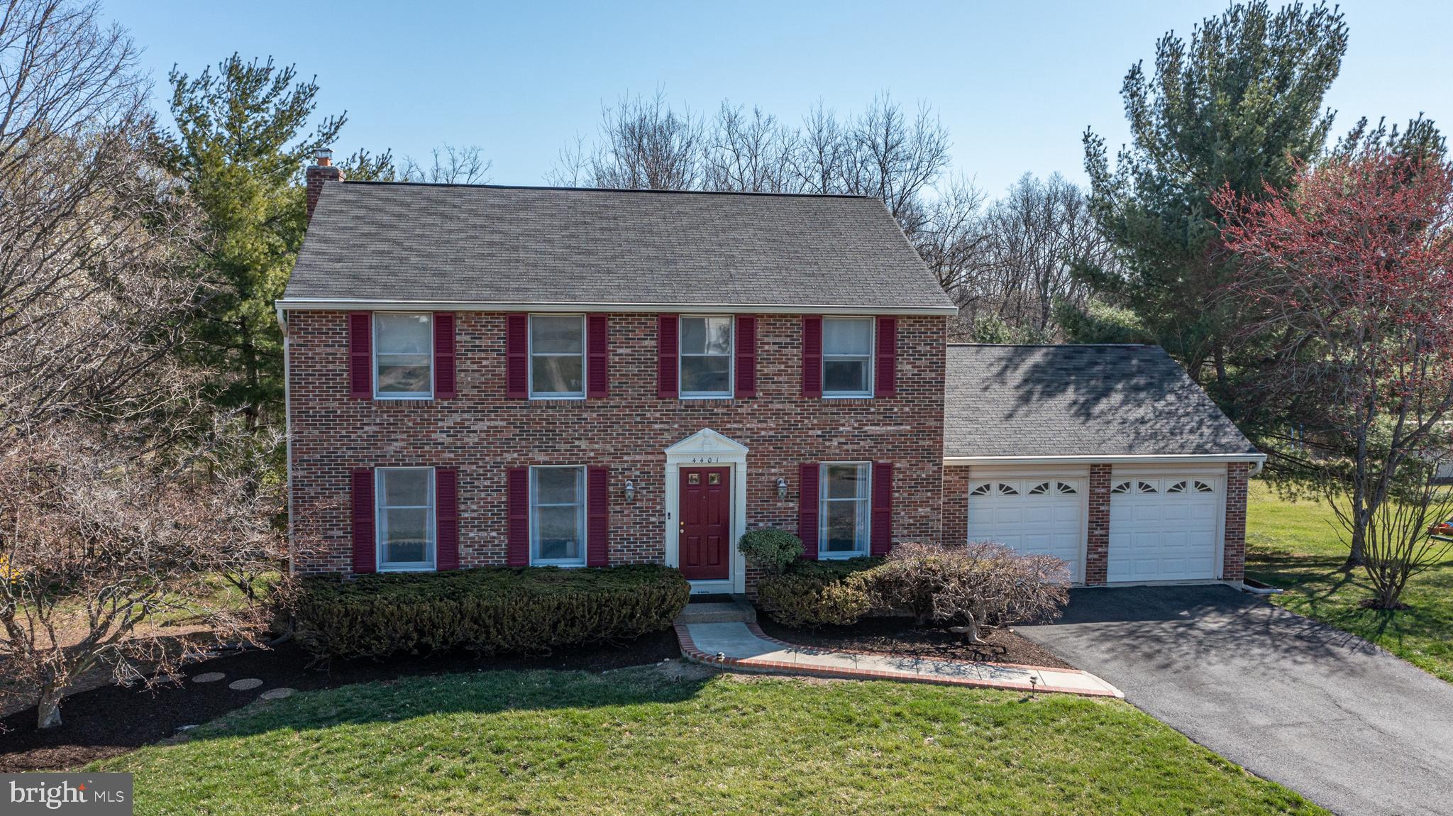 4401 Cub Run Road Chantilly, VA 20151 - Photo 2 of 60 a view of a brick house with a yard plants and large tree