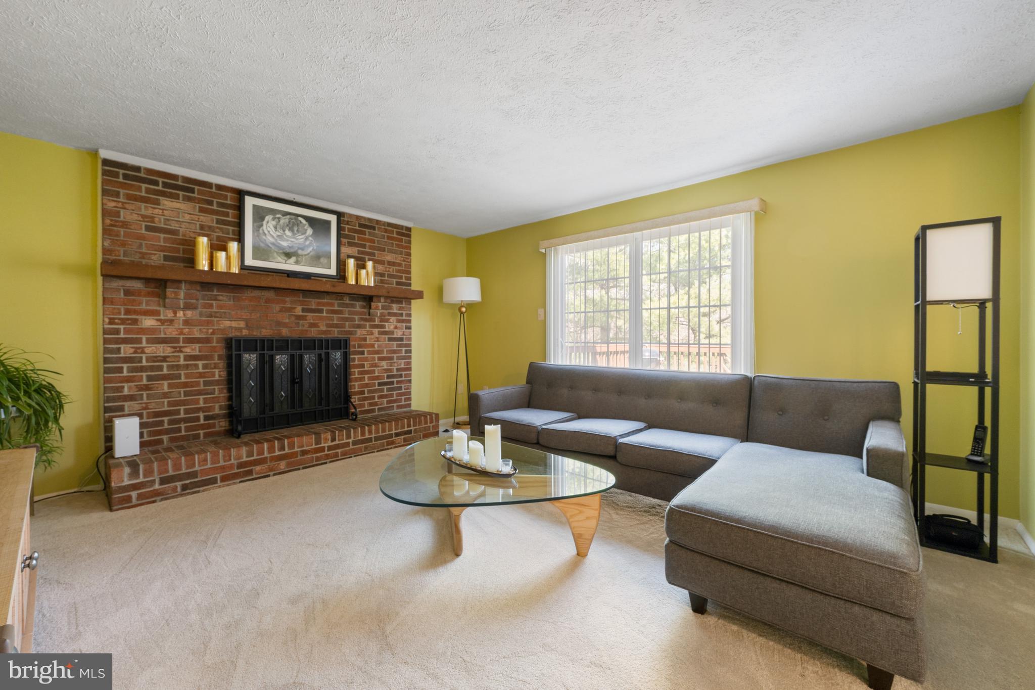 4401 Cub Run Road Chantilly, VA 20151 - Photo 22 of 60 a living room with furniture and a fireplace