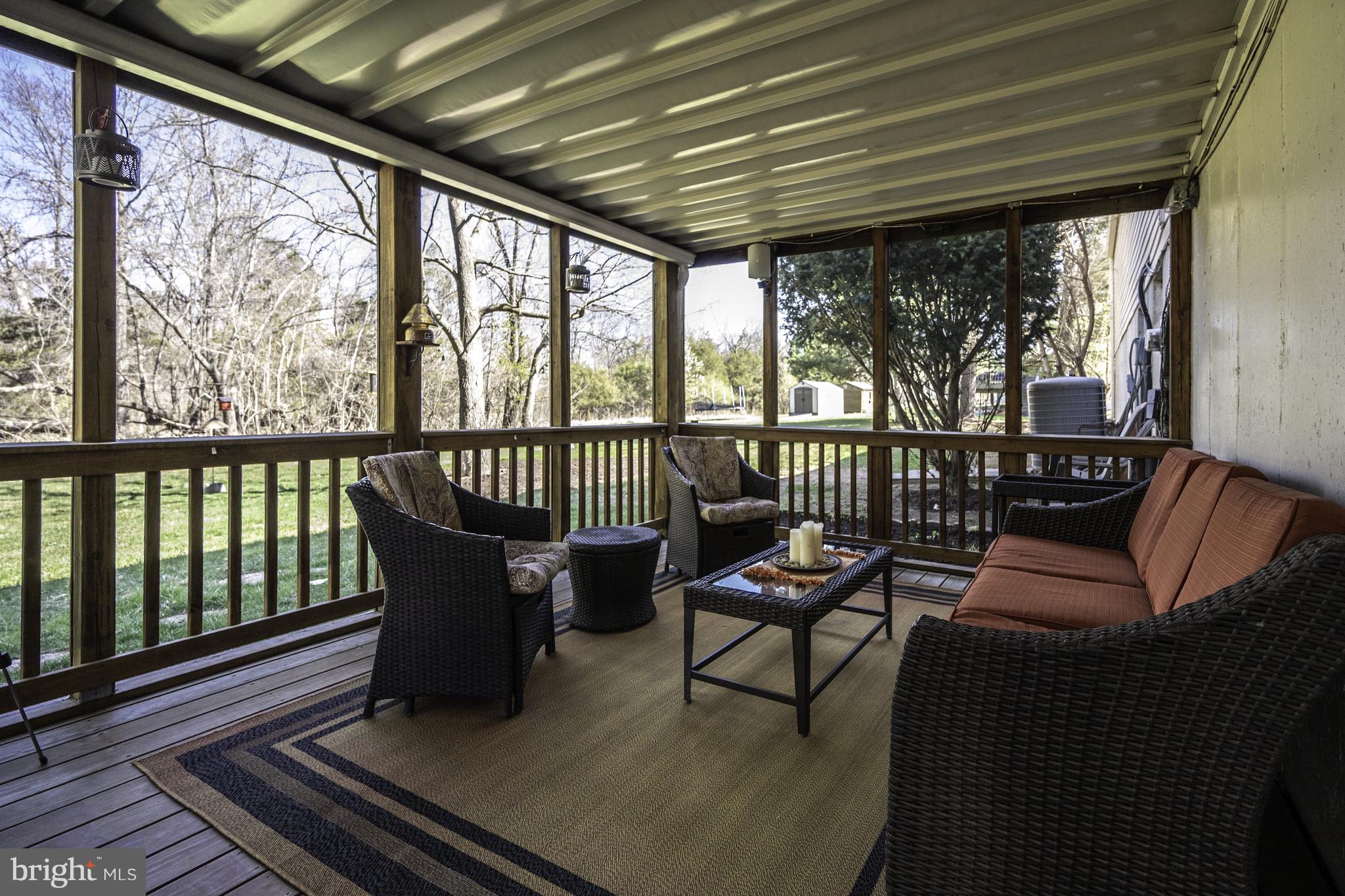 4401 Cub Run Road Chantilly, VA 20151 - Photo 40 of 60 a balcony with wooden benches and large windows