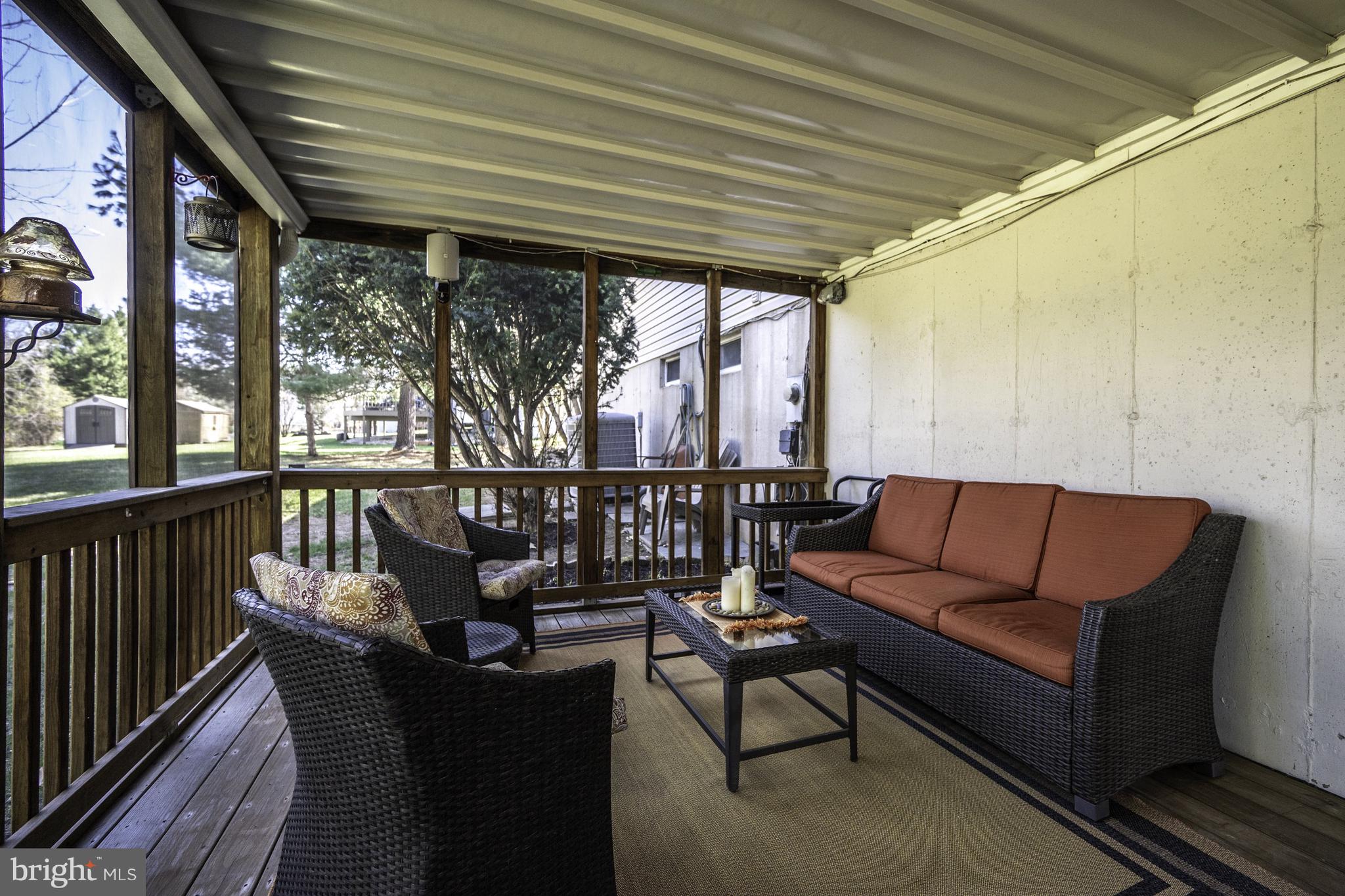 4401 Cub Run Road Chantilly, VA 20151 - Photo 41 of 60 a balcony with wooden floor stairs and a potted plant