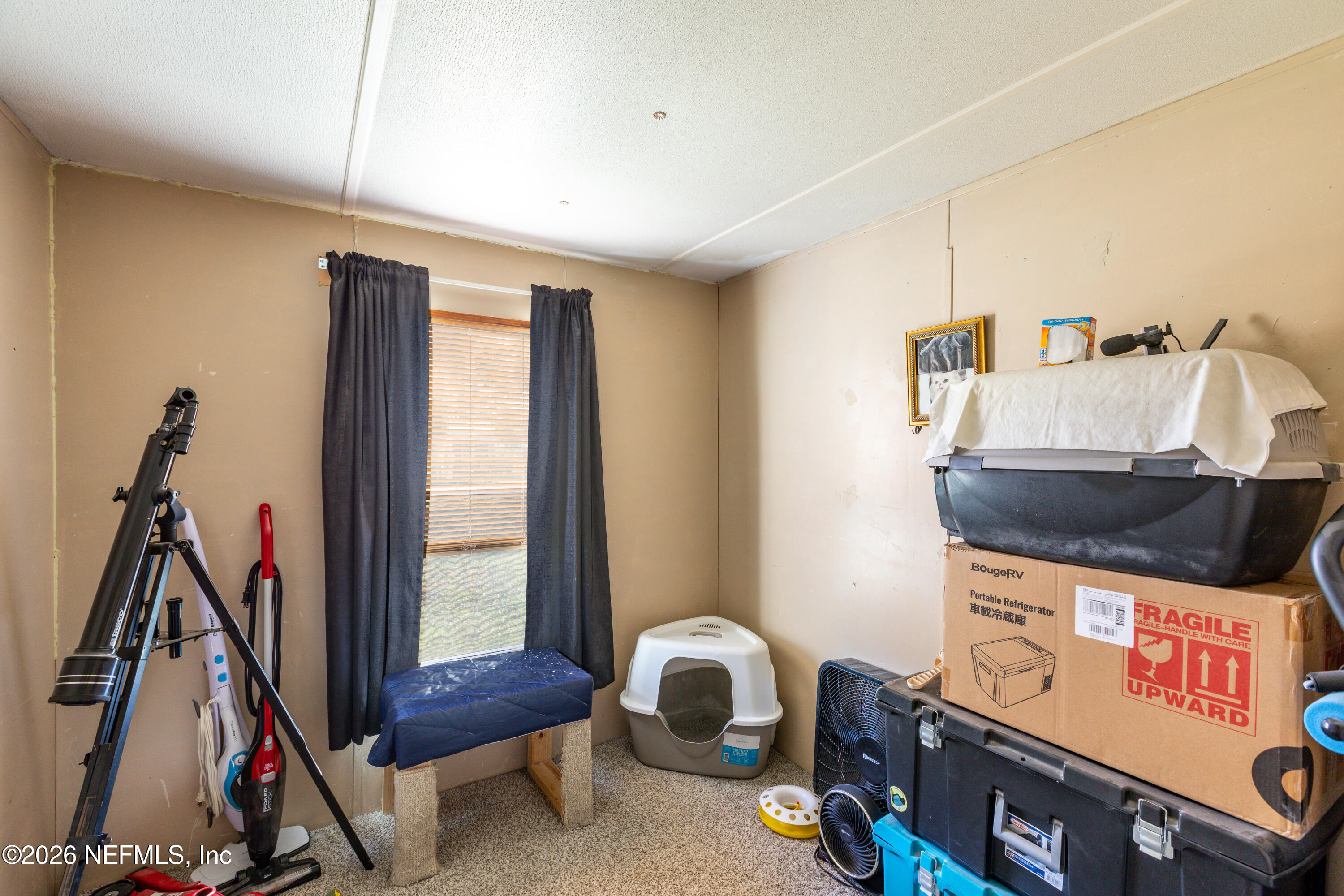 11830 Southwest 45th Terrace Lake Butler, FL 32054 - Photo 11 of 16 a room with furniture and a window