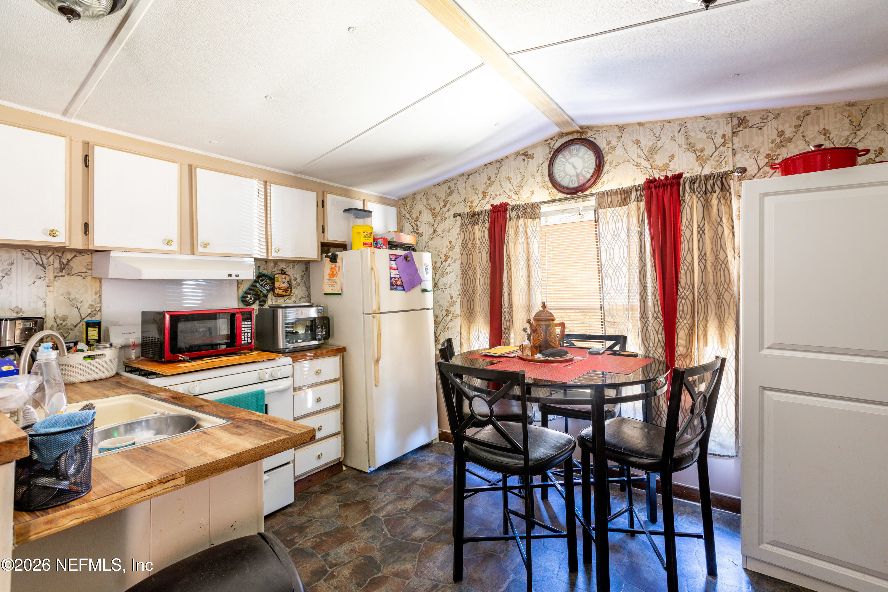 11830 Southwest 45th Terrace Lake Butler, FL 32054 - Photo 13 of 16 a view of a dining room with furniture window and outside view
