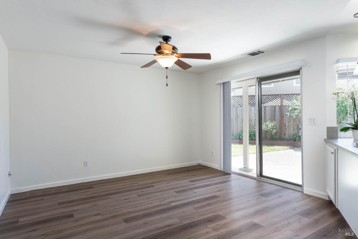 2454 Dunaway Drive Santa Rosa, CA 95403 - Photo 13 of 17 wooden floor in an empty room with a window