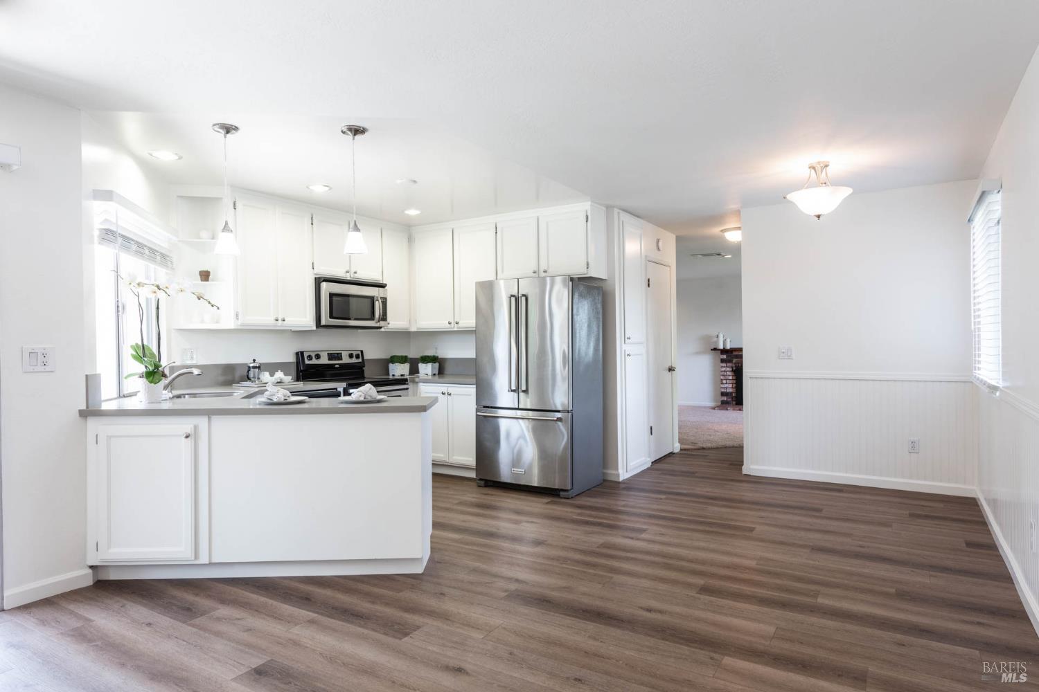 2454 Dunaway Drive Santa Rosa, CA 95403 - Photo 14 of 17 a kitchen with stainless steel appliances a refrigerator sink and microwave