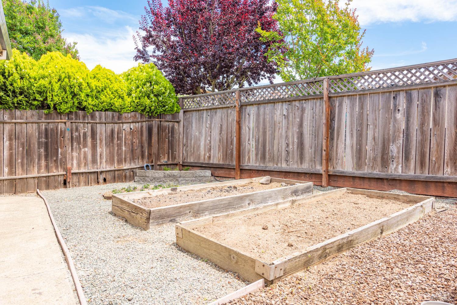 2454 Dunaway Drive Santa Rosa, CA 95403 - Photo 7 of 17 a view of a backyard with wooden fence