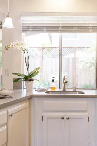 a bathroom with a sink and a window