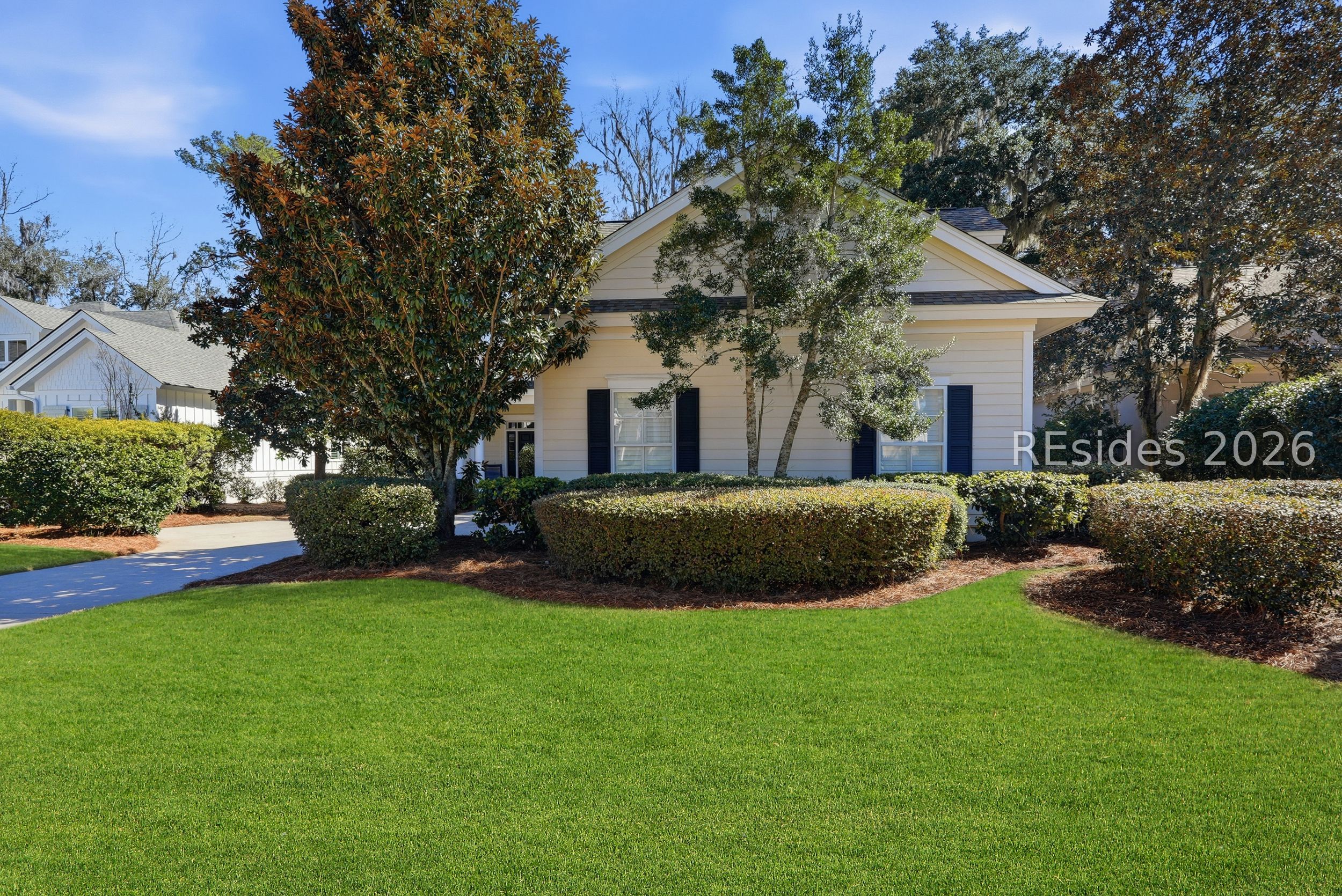 11 Hunting Court Bluffton, SC 29910 - Photo 2 of 56 Front/Garage of home (Grass virtually enhanced)