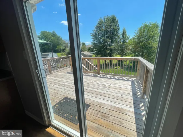 a view of balcony with wooden floor