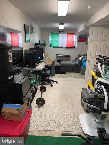 a living room with furniture a rug and a flat screen tv