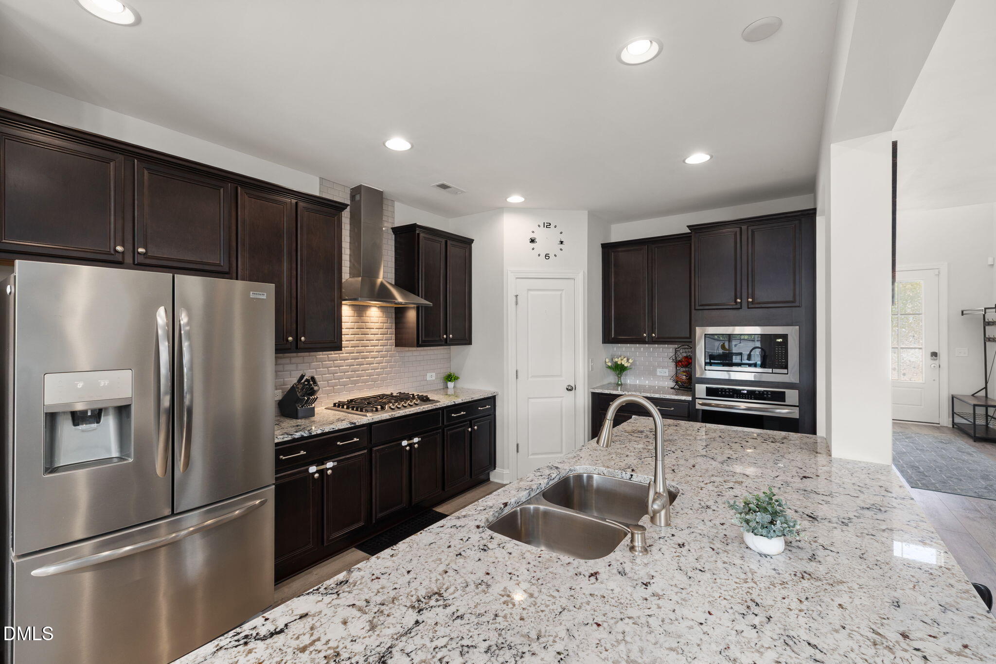 3422 Longleaf Estates Drive Raleigh, NC 27616 - Photo 18 of 71 a kitchen with stainless steel appliances granite countertop a refrigerator stove and sink