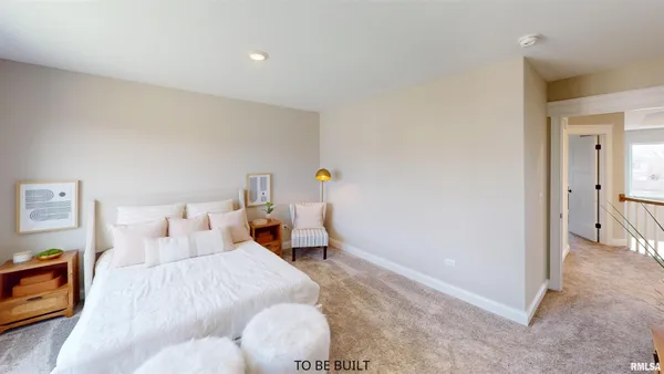 a bedroom with a bed and hallway