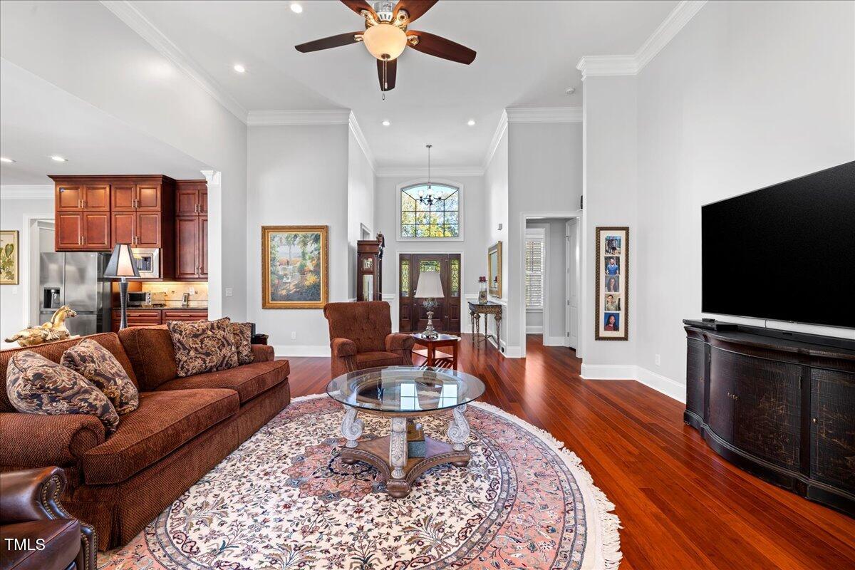 2304 Gresham Lake Road Raleigh, NC 27615 - Photo 11 of 55 a living room with fireplace furniture and a flat screen tv