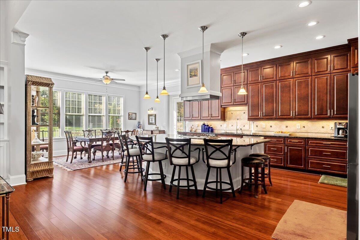 2304 Gresham Lake Road Raleigh, NC 27615 - Photo 13 of 55 a kitchen with lots of counter top space and wooden floor