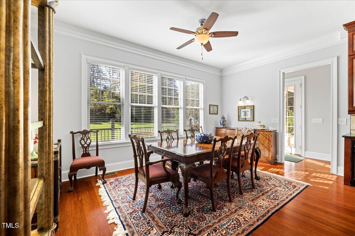 2304 Gresham Lake Road Raleigh, NC 27615 - Photo 20 of 55 a view of a dining room with furniture window and wooden floor