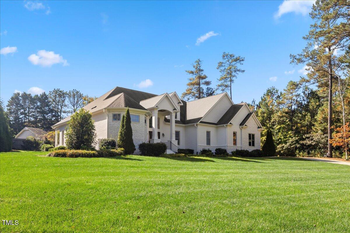 2304 Gresham Lake Road Raleigh, NC 27615 - Photo 2 of 55 a front view of house with yard and green space