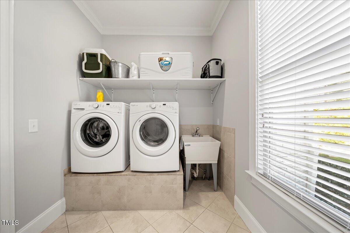 2304 Gresham Lake Road Raleigh, NC 27615 - Photo 24 of 55 a utility room with dryer and washer