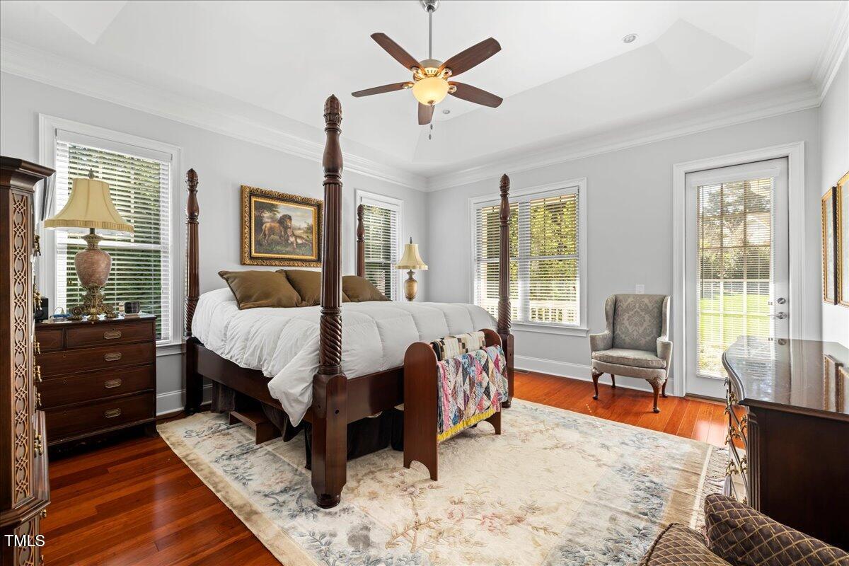 2304 Gresham Lake Road Raleigh, NC 27615 - Photo 26 of 55 a bedroom with a bed and wooden floor