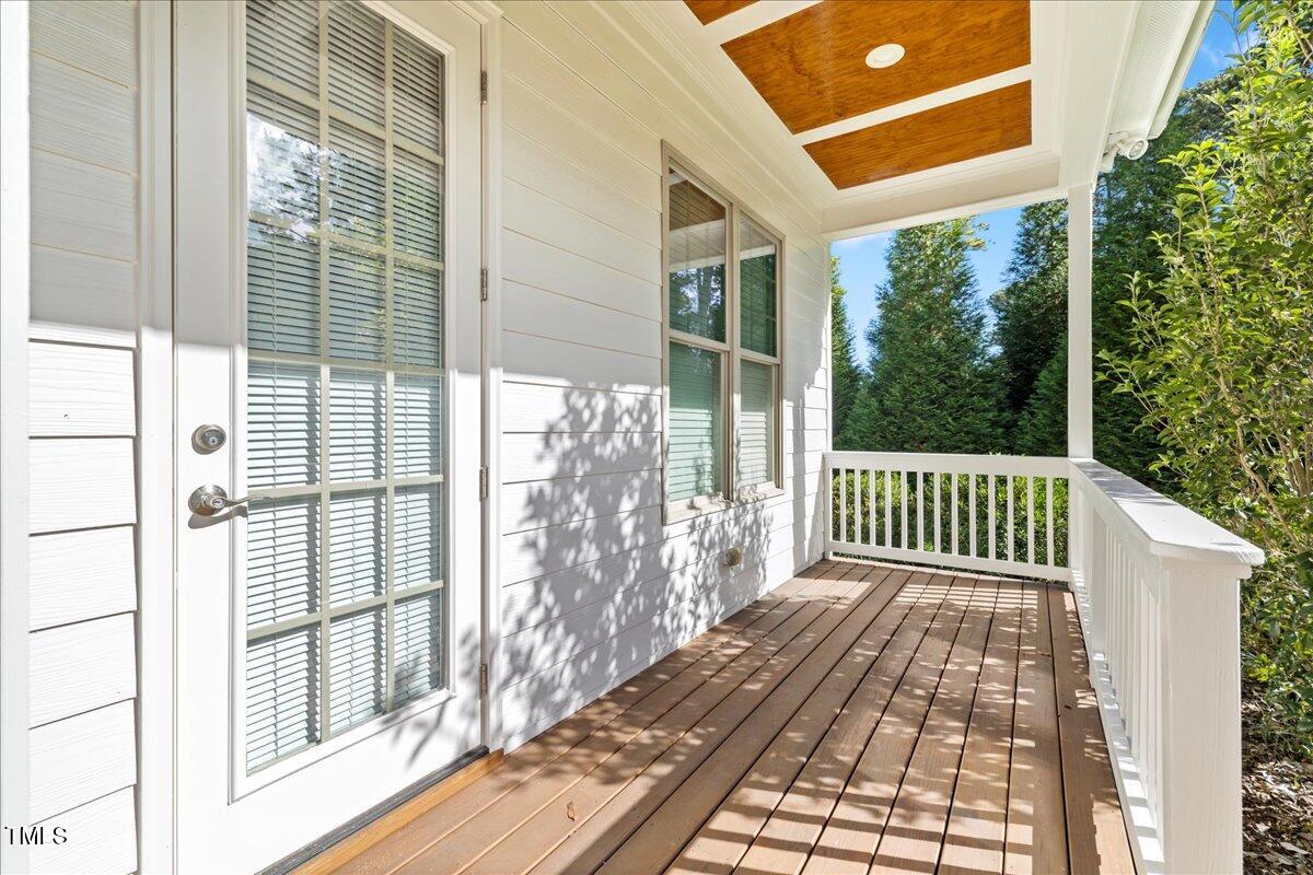 2304 Gresham Lake Road Raleigh, NC 27615 - Photo 27 of 55 a porch with a wooden floor
