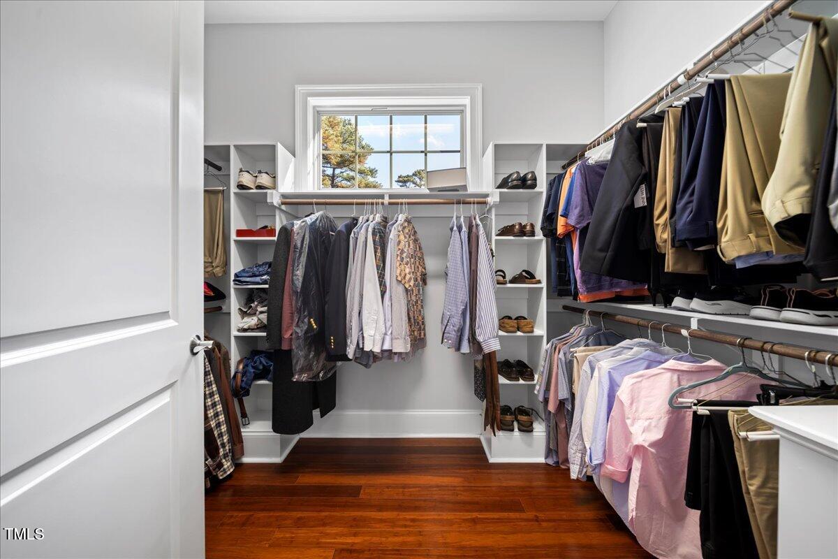 2304 Gresham Lake Road Raleigh, NC 27615 - Photo 29 of 55 a view of walk in closet with clothes and shoes