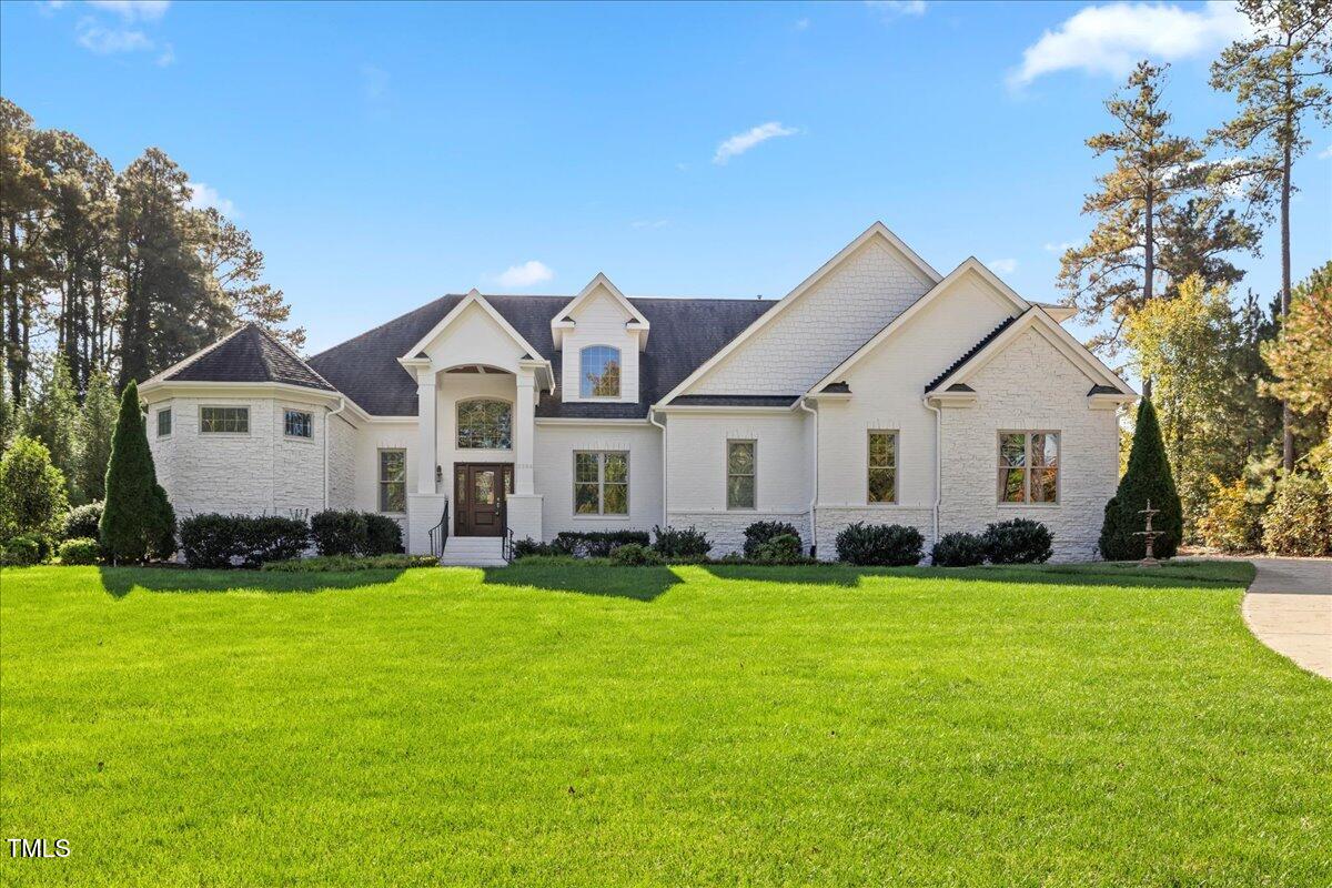 2304 Gresham Lake Road Raleigh, NC 27615 - Photo 3 of 55 a front view of a house with a yard