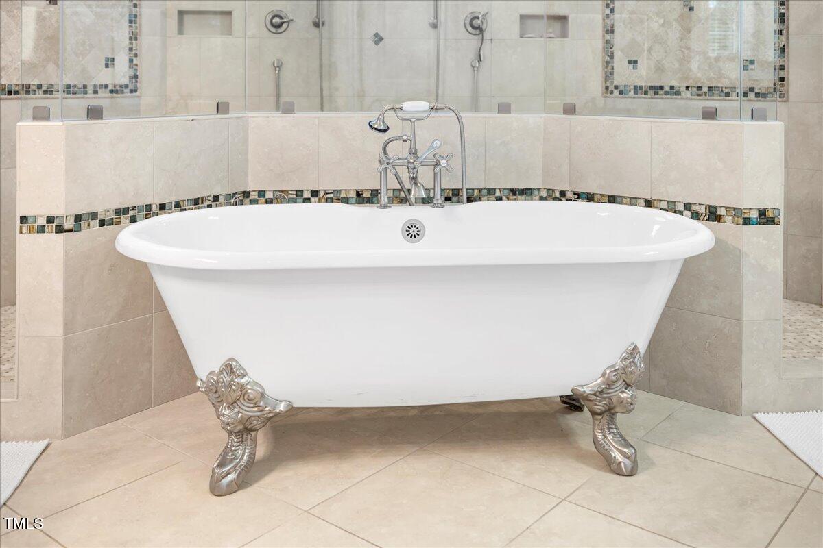 2304 Gresham Lake Road Raleigh, NC 27615 - Photo 34 of 55 a bathroom with a bathtub