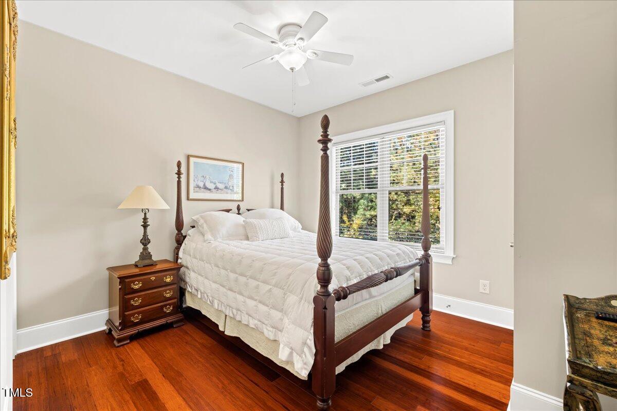 2304 Gresham Lake Road Raleigh, NC 27615 - Photo 37 of 55 a bed sitting in a bedroom next to a window