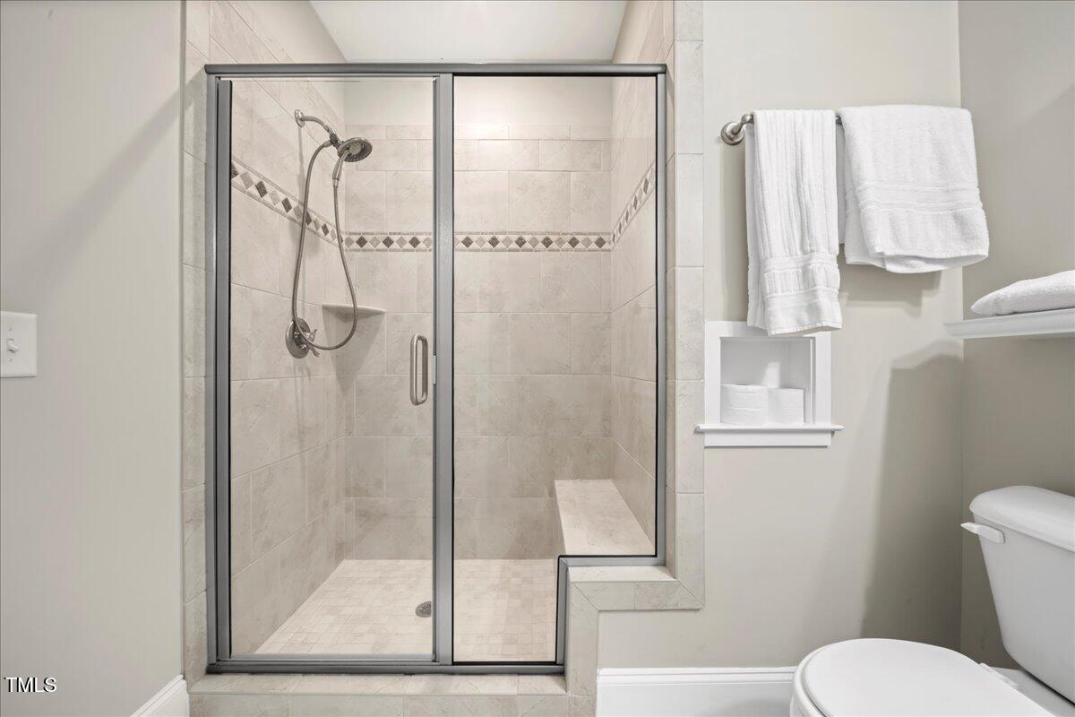 2304 Gresham Lake Road Raleigh, NC 27615 - Photo 40 of 55 a bathroom with a shower toilet and sink