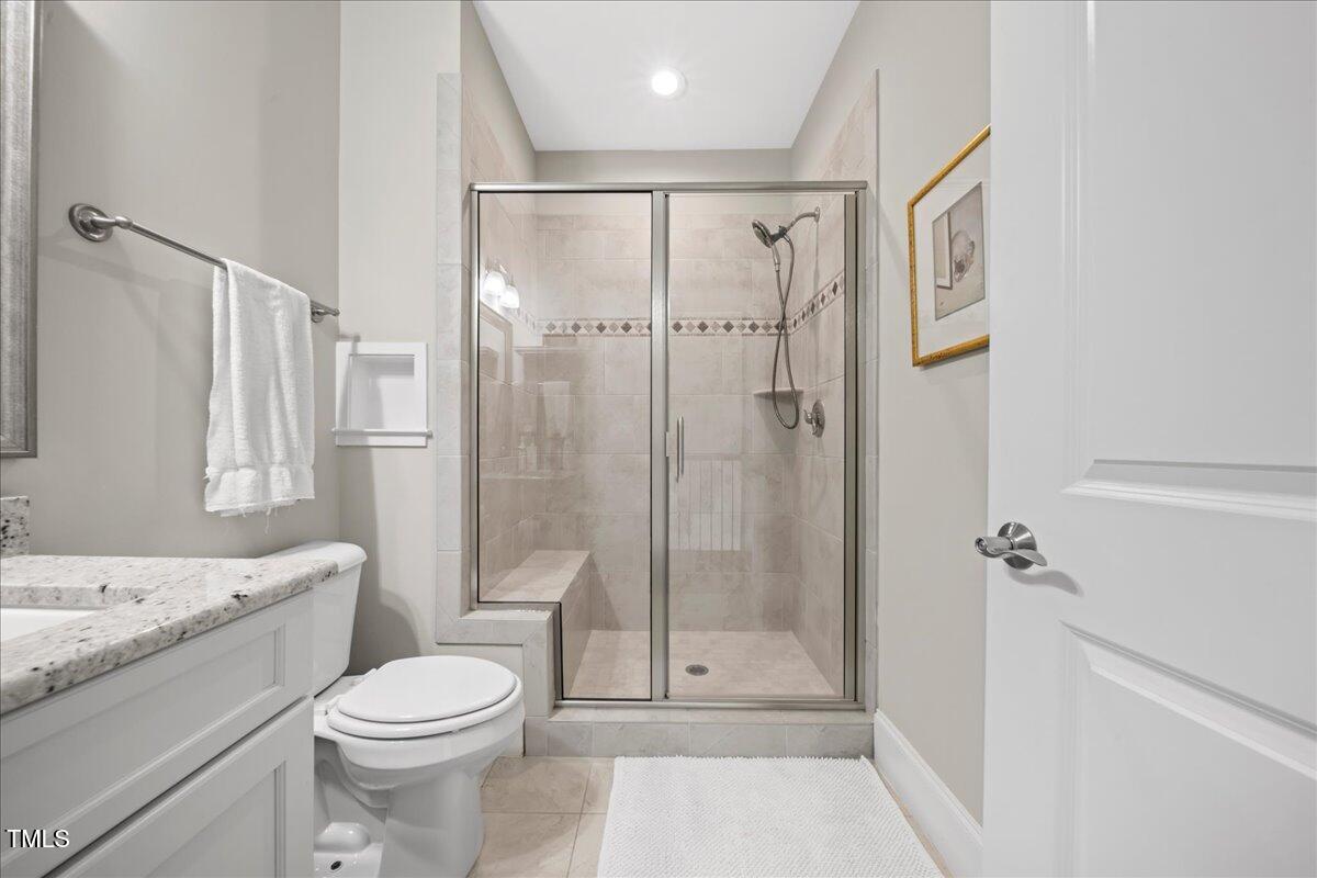 2304 Gresham Lake Road Raleigh, NC 27615 - Photo 46 of 55 a bathroom with a sink a toilet and shower