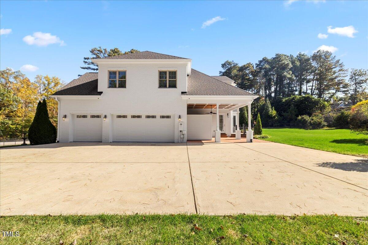 2304 Gresham Lake Road Raleigh, NC 27615 - Photo 51 of 55 a view of a house with a yard
