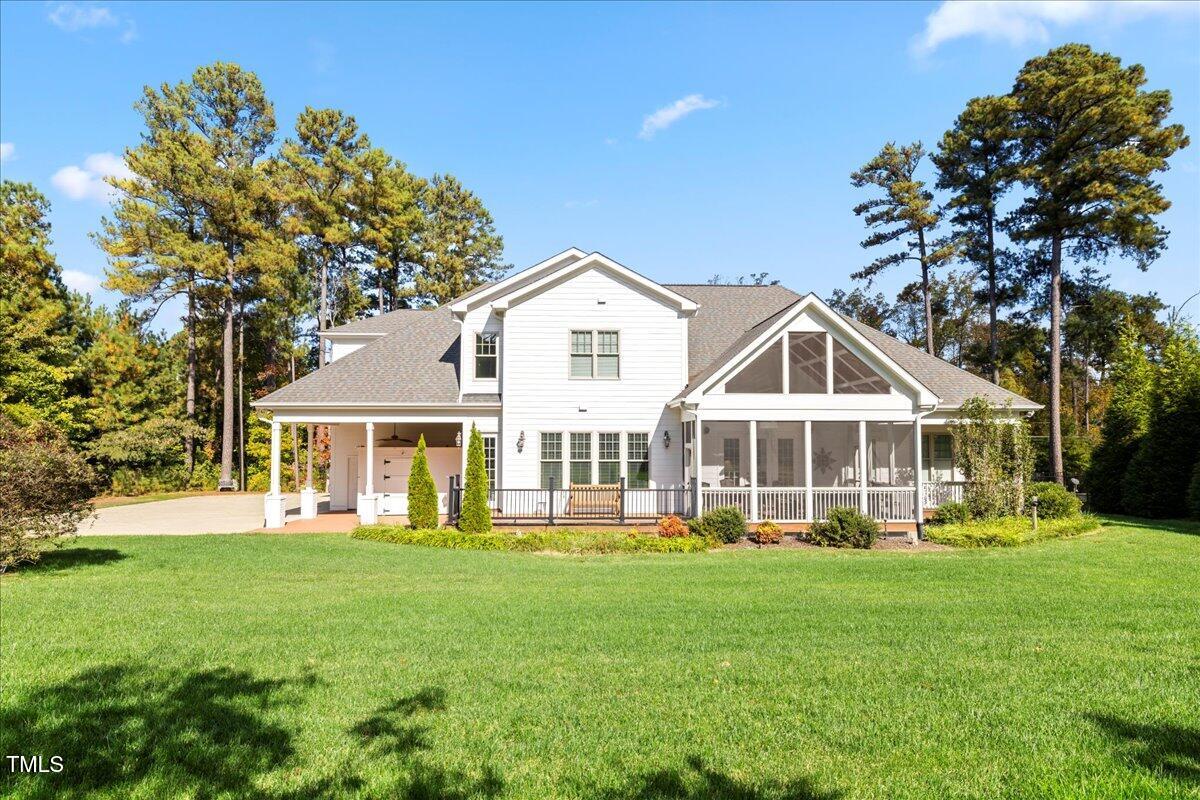 2304 Gresham Lake Road Raleigh, NC 27615 - Photo 53 of 55 a front view of a house with a yard and trees