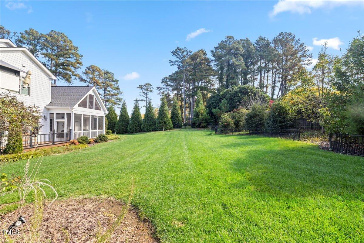 2304 Gresham Lake Road Raleigh, NC 27615 - Photo 55 of 55 a view of a house with backyard and garden