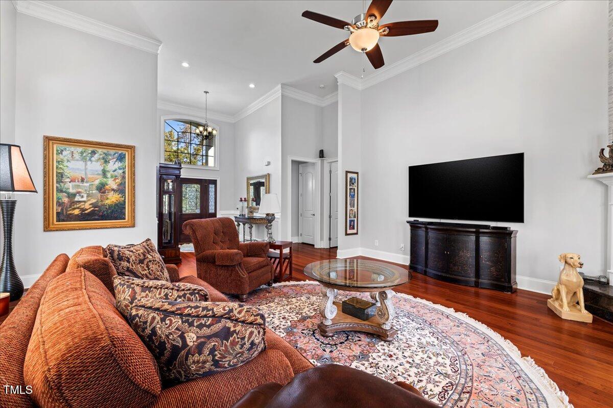 2304 Gresham Lake Road Raleigh, NC 27615 - Photo 10 of 55 a living room with furniture and a flat screen tv