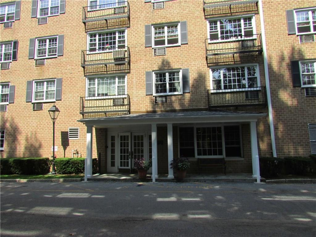 a view of a brick building with many windows