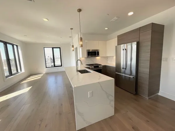 a front view of a brick building with a large window