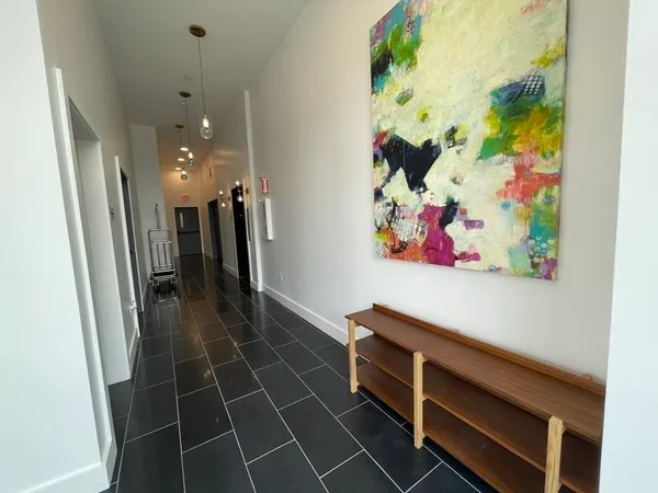 a living room with furniture rug and window