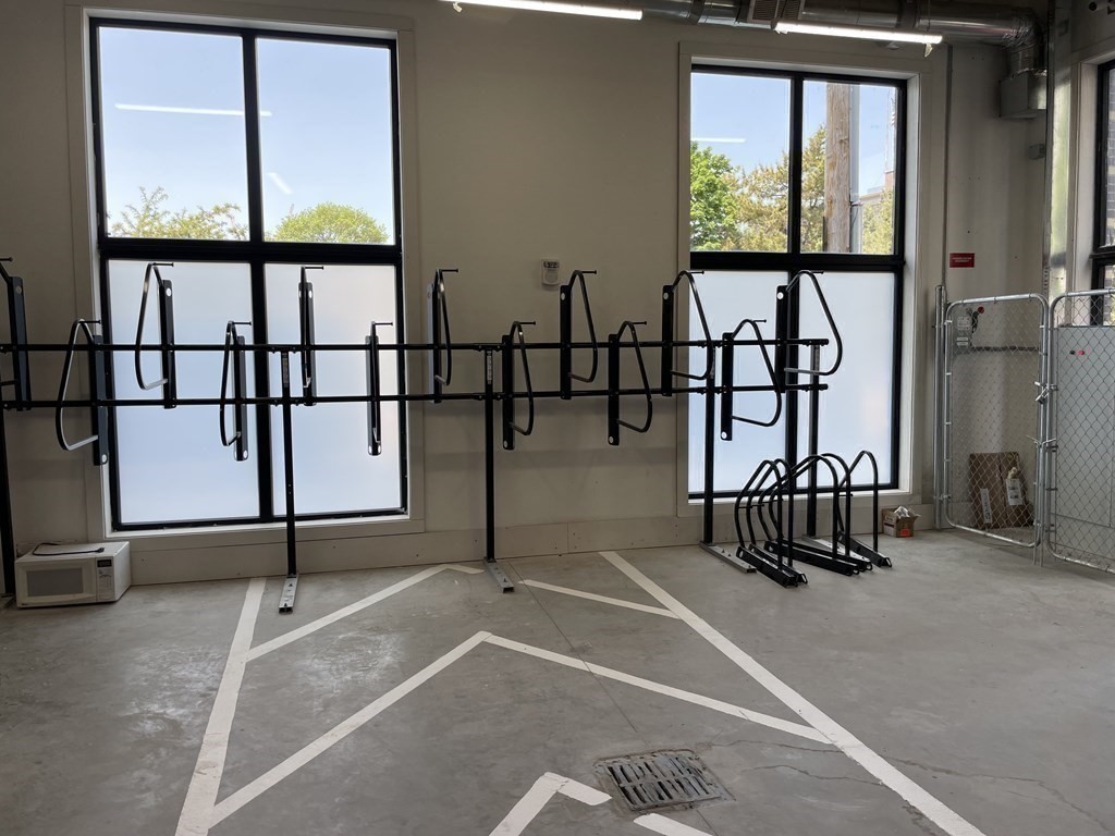 30 Penniman Road, Unit 507 Boston, MA 02134 - Photo 20 of 22 an empty room with windows